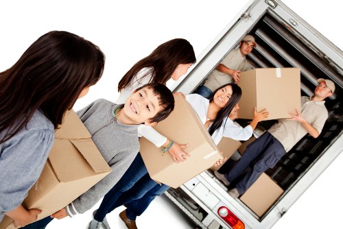 Employees and customers following health and safety practices in a storage facility