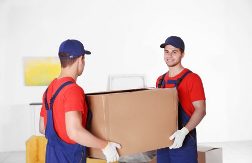 Professional packing services in Highbury preparing household items for a move