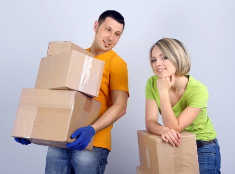 Professional team loading belongings for a flat move